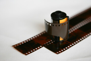 roll of vintage film negative on white background
