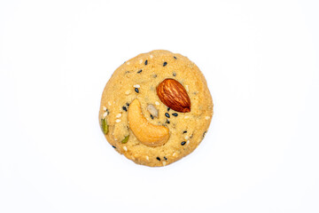 Isolated Healthy Whole Grain Cookies with different seeds, cashew nuts, almond, black sesame, pumpkin seed on white background