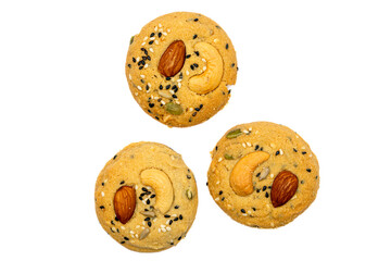 Many Healthy Whole Grain Cookies with different seeds, cashew nuts, almond, black sesame, pumpkin seed on white background