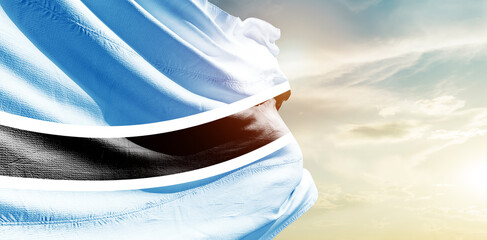 Botswana national flag waving in the sky. - obrazy, fototapety, plakaty