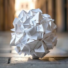A ball of crumpled paper on a dark brown table