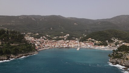 Fototapeta na wymiar aerial view wild sea waves crushing on rocks in parga town epirus greece