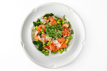 Vegetarian salad of salmon, avocado, green beans on a white plate. Banquet festive dishes. Gourmet restaurant menu. White background.