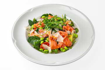 Vegetarian salad of salmon, avocado, green beans on a white plate. Banquet festive dishes. Gourmet restaurant menu. White background.