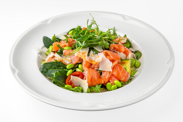 Vegetarian salad of salmon, avocado, green beans on a white plate. Banquet festive dishes. Gourmet restaurant menu. White background.