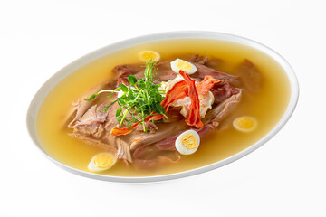 Chicken cholodets. Zalivnoe, a traditional Russian dishon in a white plate. Banquet festive dishes. Gourmet restaurant menu. White background.