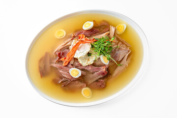 Chicken cholodets. Zalivnoe, a traditional Russian dishon in a white plate. Banquet festive dishes. Gourmet restaurant menu. White background.