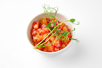 Salmon buffet appetizer, tartare on a white plate. Banquet festive dishes. Gourmet restaurant menu. White background.