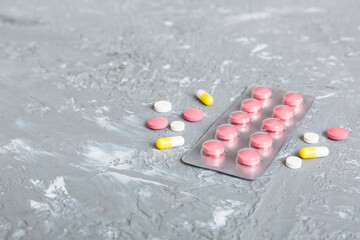 Blister package with Vitamin on color background. Medicine pills on a light background. Medicines...