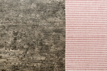 Fototapeta premium top view with red empty kitchen napkin isolated on table background. Folded cloth for mockup with copy space, Flat lay. Minimal style