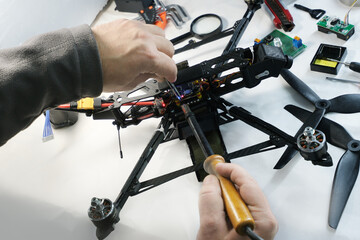 Engineer solders and assembles fpv drone - 769504604