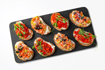 Bruschettas with salmon and tomato. Banquet festive dishes. Gourmet restaurant menu. White background.