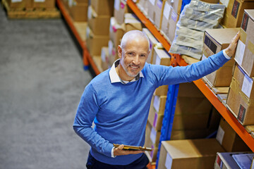 Above, box or portrait of man in warehouse for delivery order label, storage or stock in factory with tablet. Printing, happy mature manager or supplier inspection for package or wholesale shipping