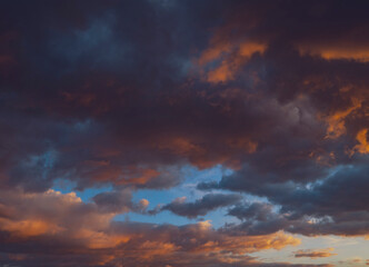 Naklejka na ściany i meble dramatic an colorful sunset clouds