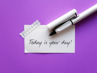 White note on purple background with handwriting - TODAY IS YOUR DAY - positive self talk...