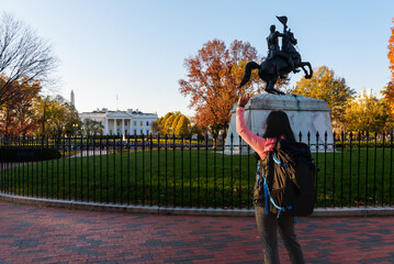 An Asian tourist woman Exploring the Legacy of the White House. The iconic symbol of American democracy