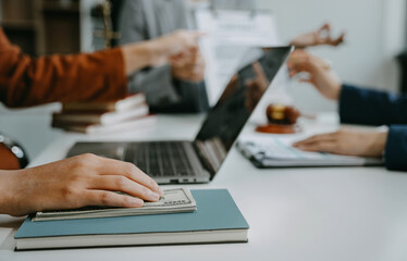 Fototapeta premium Teamwork of business lawyer meeting working hard about legal legislation in courtroom to help their customer.