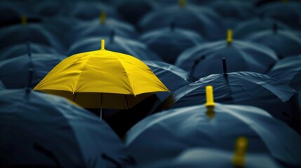 A captivating image featuring a unique yellow umbrella standing out among many dark ones - obrazy, fototapety, plakaty