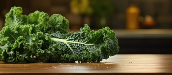 A leaf vegetable, kale, is placed on a wooden table. The contrast between the terrestrial plant and hardwood creates a beautiful landscape in the grassy flooring