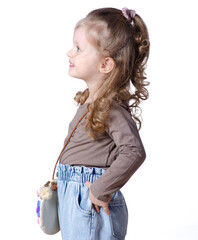 Little girl child in jeans and shirt looking smiling on white background isolation