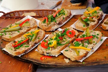 Sandwiches made of home-made bread with lard, cucumber, chives and peppers at a stall during a fair...