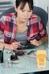 woman technician reading the voltage