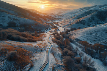 Aerial view of a path passing through a beautiful valley during sunset