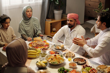 Muslim Family Enjoying Festive Dinner On Uraza Bayram