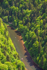 Dunajec River with rafters in sunny summer day. Aerial view, Pieniny mountains, Poland.