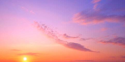 Sunset sky in the evening with yellow sunlight and clouds on panoramic colorful sunrise sky background, Beautiful idyllic natural tranquil scene