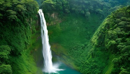 Majestic Towering Waterfall Surrounded By Lush Gr - obrazy, fototapety, plakaty