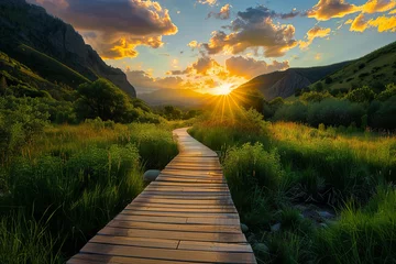 Fotobehang A wooden path through a beautiful valley during sunset © grey