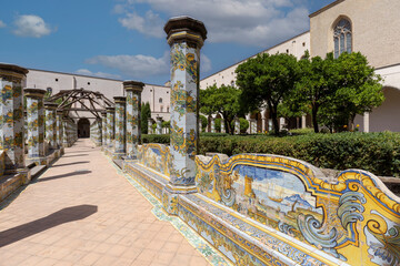 Cloister Santa Chiara with octagonal columns decorated with majolica tiles in rococo style, Naples,...