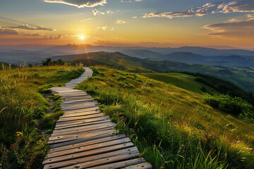 Fototapeta premium A wooden path through beautiful green hills during sunset