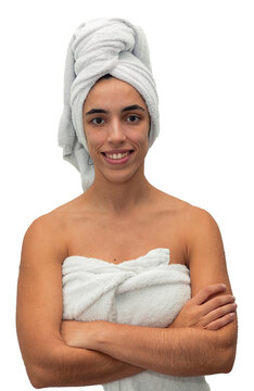 young woman, with a towel wrapped around her chest and head, stands with crossed arms, looking at the camera with a smile after a shower, radiating freshness and confidence on tranparent background