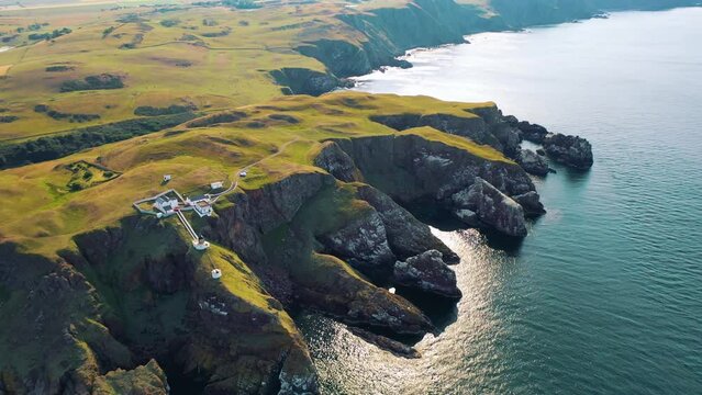 Hovering Over History: St Abbs Head Lighthouse and Rugged Cliffs, Scottish Coast and Coastal Wildlife Habitat, Scotland
