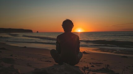 Fototapeta premium Person Enjoying a sunset from a simple, quiet beach