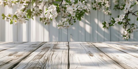 A wooden table adorned with white flowers set against a neutral spring mockup blurred background