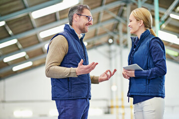 Male manager, meeting and conversation with tablet in warehouse for consultation with leadership in...