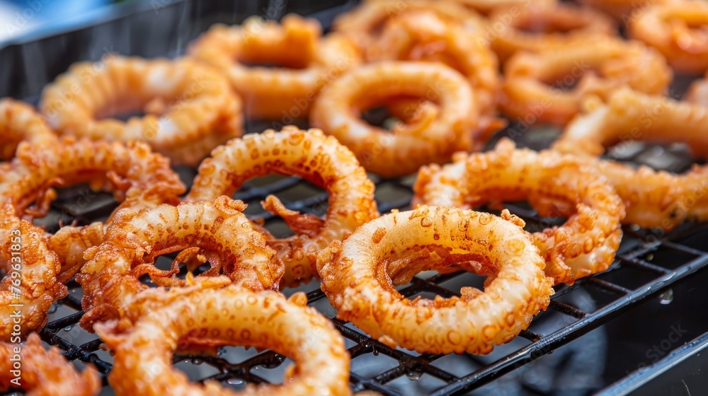 Wall mural Delicious crispy calamari rings fried to golden perfection, tender and delightful - Wall murals