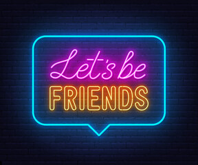 Lets Be Friends neon sign in the speech bubble on brick wall background.
