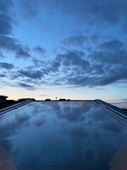 Fototapeta premium clouds over the window glass