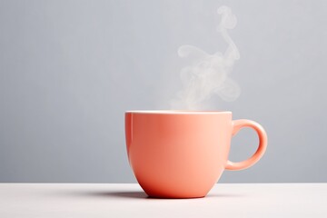 a pink coffee cup with steam coming out of it