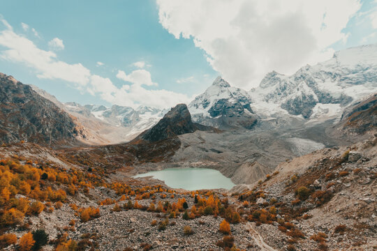 Alpine lake formed due to melting ice, blue lake