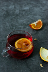 Blood oranges in wooden box or black plate
