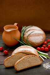 rustic hearth bread with vegetables, herbs and milk. tomorrow in the countryside of bread and vegetables. natural sourdough bread.