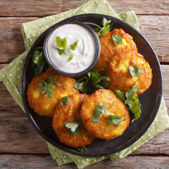 indian potato patties aloo tikki served with yogurt close up in a dish on the table