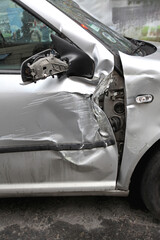 Crushed Door Damaged Silver Car Traffic Accident Insurance