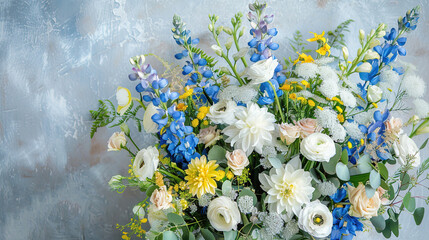 Flower decoration idea. bouquet of white, blue, and yellow flowers on a plain background
