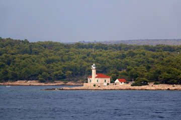 Small picturesque lighthouse on the island in the Adriatic Sea.